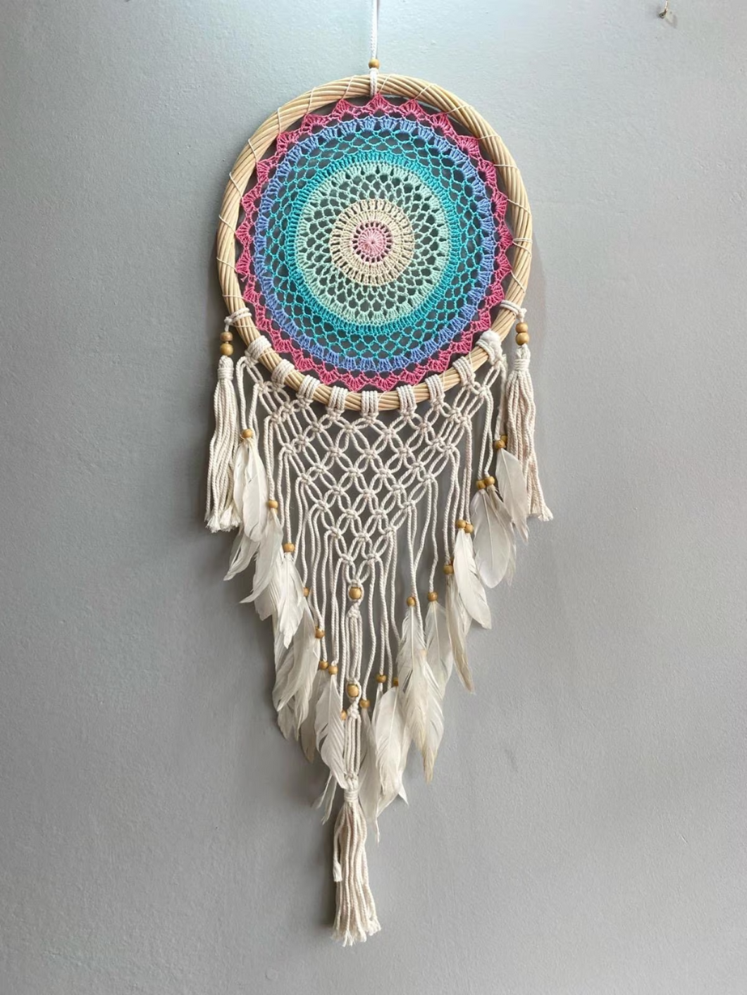 Big rainbow dreamcatcher with feathers.