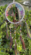 White tree of life dream catcher with crystals and tassels.