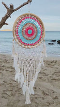 Load and play video in Gallery viewer, Colorful boho dreamcatcher with feathers and rattan frame.
