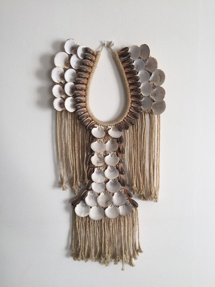 Big shell necklace wall decor.